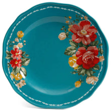 Teal dinner plate with scattered red and yellow flowers and green leaves border