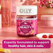 OLLY biotin beauty gummies bottle with red gummies beside it