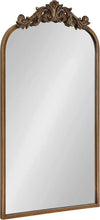 Gold arched wall mirror with ornate baroque-style frame