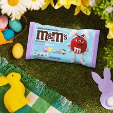 Milk chocolate M&M's pastel blend candy bag on grass with Easter eggs