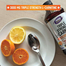 Triple Strength L-carnitine bottle with citrus slices on plate and spoon