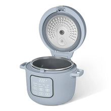 Cornflower blue electric rice cooker with open lid and steaming insert in pot.