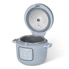 Cornflower blue rice cooker with lid open, showing steam holes and inner pot