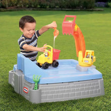 Digger sandbox playset on grass with blue ramp, gray base, child operating toy