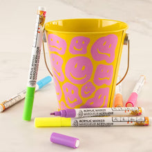 Neon acrylic markers with 1.2mm fine tips, assorted colors with caps and tips visible