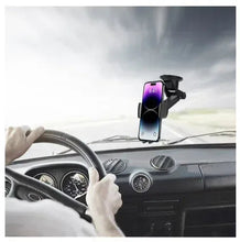 Black dashboard phone mount securing a smartphone near the windshield