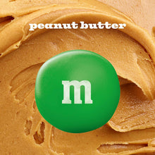 Green M&M candy on peanut butter spread