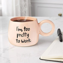 Light peach ceramic mug with “I'm too pretty to work” text and rising steam