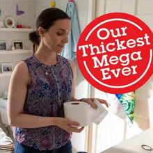 Toilet paper roll pack held by woman, teal and white packaging
