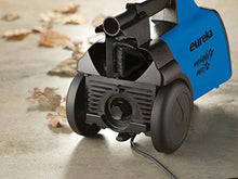 Blue canister vacuum cleaner side view with wheel and hose nozzle