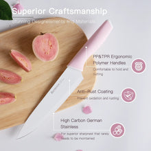 Kitchen chef knife with pink handle, stainless blade on a wooden cutting board