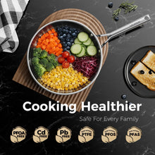 Black nonstick frying pan with diced vegetables, stainless-steel handle