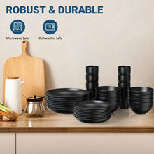 Black wheat-straw dinnerware set with stacked bowls, plates, and cups