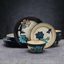 Stoneware dinnerware set with butterfly blue and teal flower motifs, cream bowls and dark tray