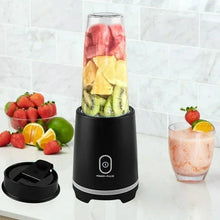 Mainstays black personal blender with mixed fruits in clear jar and travel lid