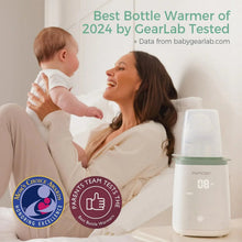 Bottle warmer on bedside table beside mother and baby