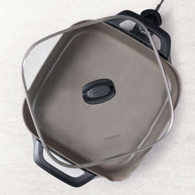 Ceramic electric skillet with glass lid and black knob, power cord shown