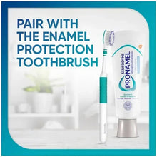 Toothpaste box panel showing tube with teal cap beside enamel protection toothbrush