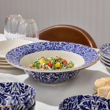 Navy and white ceramic serve bowl filled with salad
