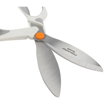 Fiskars PowerCut shears close-up with white handle, orange button, serrated blades