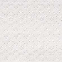 White paper towel surface with raised dots and embossed texture