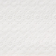White paper towel surface with raised embossed dots pattern