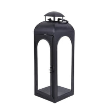 Black metal lantern candle holder with domed lid, arched windows, and handle