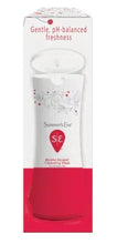 Feminine cleansing wash bottle set in tall white box with red base and floral print