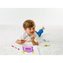 Children using mess-free markers on a coloring page in a play setting