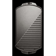 Cast iron reversible grill/griddle showing smooth top and ridged bottom cooking