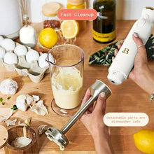 Cordless immersion blender in white icing with blending shaft and cup