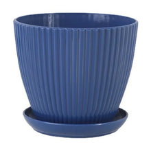 Dark blue ribbed plastic planter pot with attached saucer.