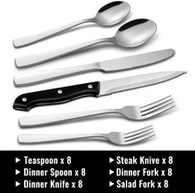Stainless steel cutlery set with black-handled knives, spoons, and dinner forks