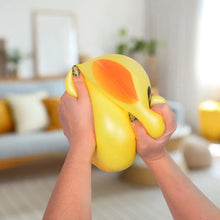 Yellow jumbo squishy duck toy with orange beak and wide cartoon eyes.