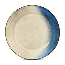 Reactive ceramic dinner plate with cream center and blue gradient rim