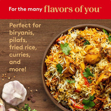 Spiced rice dish in a bowl with herbs and garlic on a platter