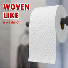 Textured white toilet paper sheet on roll core