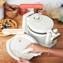 Rotating Belgian waffle maker by Drew Barrymore, white unit with handle and open plates