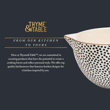 Ceramic mixing bowl with black dot pattern and measurement marks
