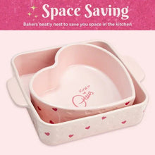 Pink heart baker nested in a square baker dish with red heart accents