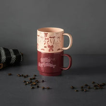 Stacking stoneware mugs with “Hello gorgeous” on the maroon mug and blush bow print