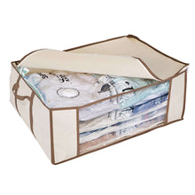 Beige compression bag tote with transparent side window, open top and folded items inside