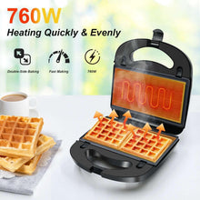 3-in-1 sandwich and waffle maker showing heating window glow with open plates