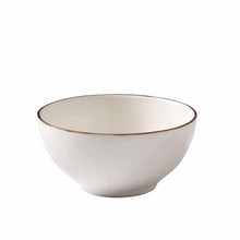 Cream stoneware bowl, round with brown rim and textured exterior glaze