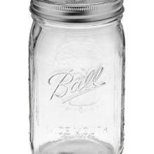 Wide mouth mason jar close-up, clear glass with Ball logo, metal lid and band