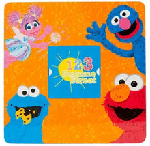 Square tabletop panel with Sesame Street 1-2-3 logo and colorful Elmo and Cookie Monster