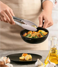 Silicone spatula with bamboo handle cooking in a skillet