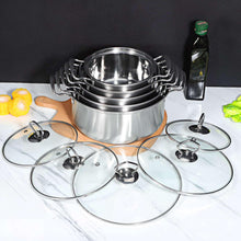Stainless steel stockpot set with stacked inserts and five glass lids