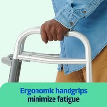 Silver folding walker with ergonomic hand grips under a person's hand