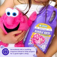 Purple bubble bath bottle held near pink plush toy